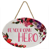 "Be Your Own Hero” | Oval Ceramic Wall Sign | 8 3/4" x 6” x 5/16”